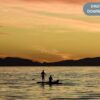 Family Paddleboarding at Sunset